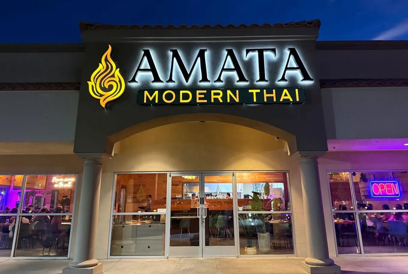 Amata Modern Thai storefront at sunset